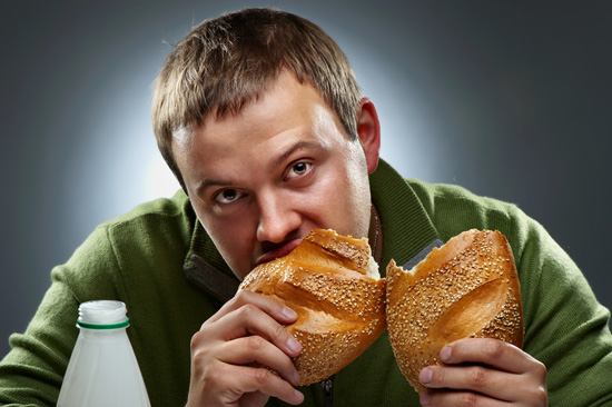 young-man-eating-bread